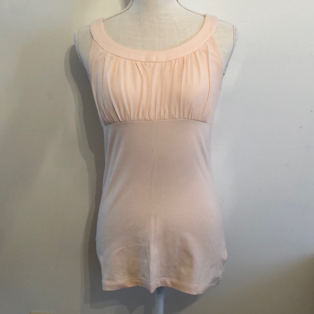 Pink tank top with rounded neckline and synched accent on bust. Size S.